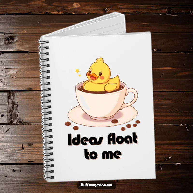 Funny Kawaii rubber duck floating merrily in a coffee-filled teacup, a humorous notebook for writing.
