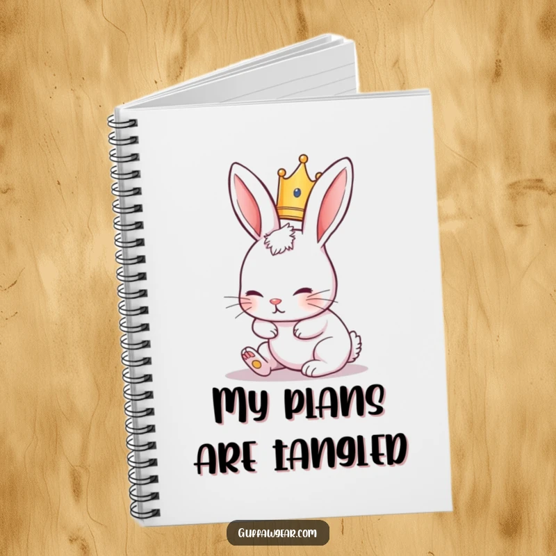 Funny Rabbit Notebook featuring a cute rabbit in a tiny crown, comically tripping over its ears, perfect for journaling.