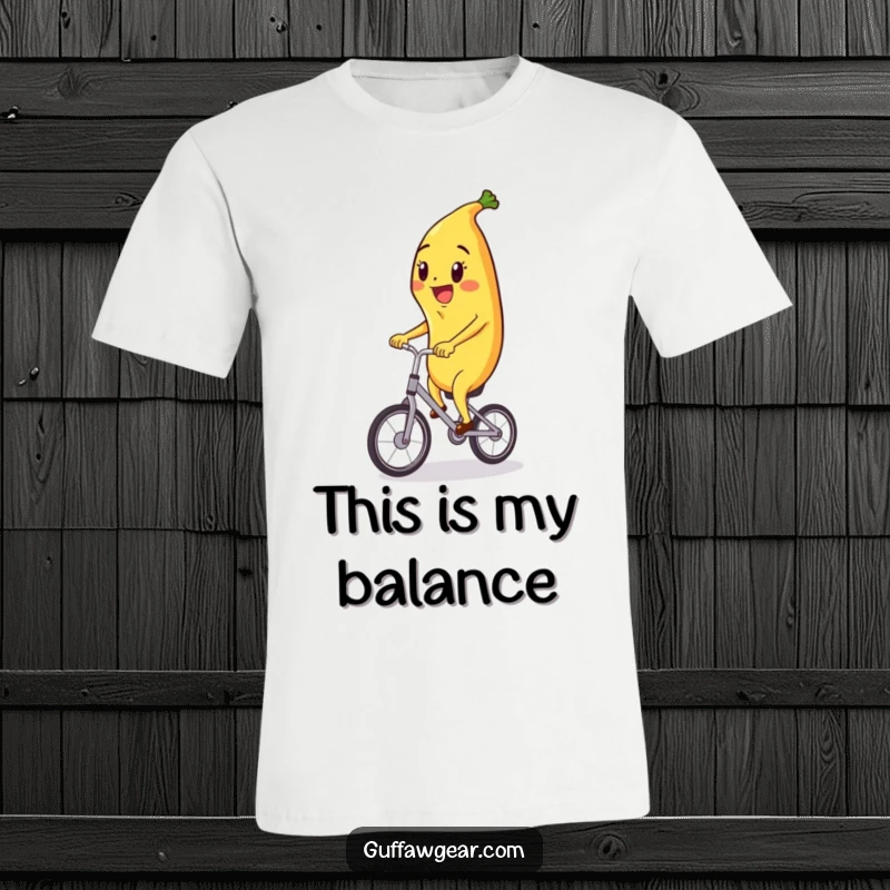 Funny t-shirt featuring a gleeful banana character effortlessly riding a tiny unicycle, showcasing impressive balance and joy.