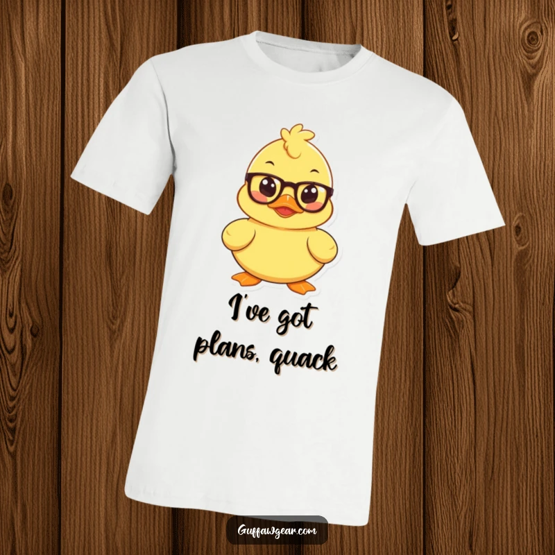 Funny t-shirt featuring a mischievous rubber duck wearing tiny spectacles, deep in thought and plotting something.