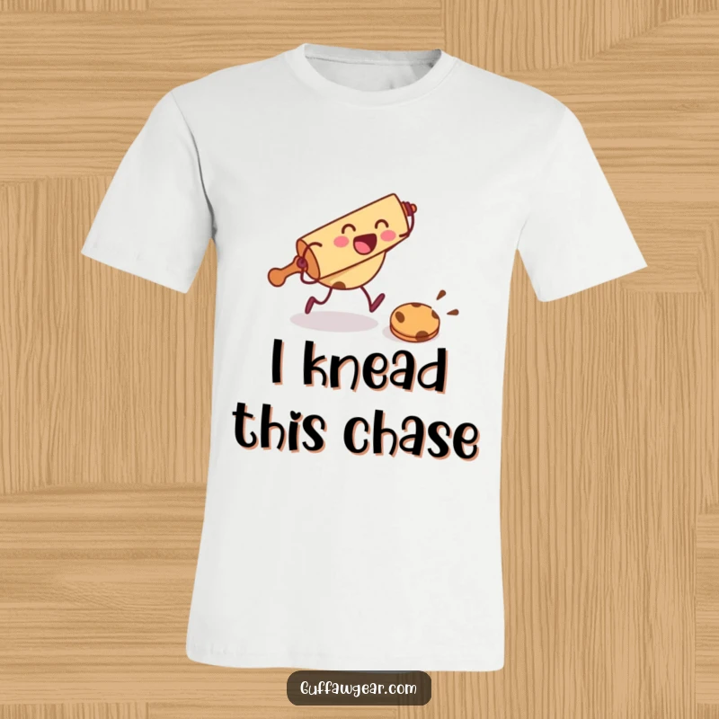 Funny t-shirt featuring a rolling pin character excitedly chasing a frightened cookie, depicting a comical baking scene.